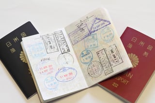 Japanese Passport And Visas On The Passport Red