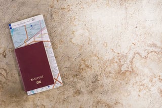 Maroon passport with travel map