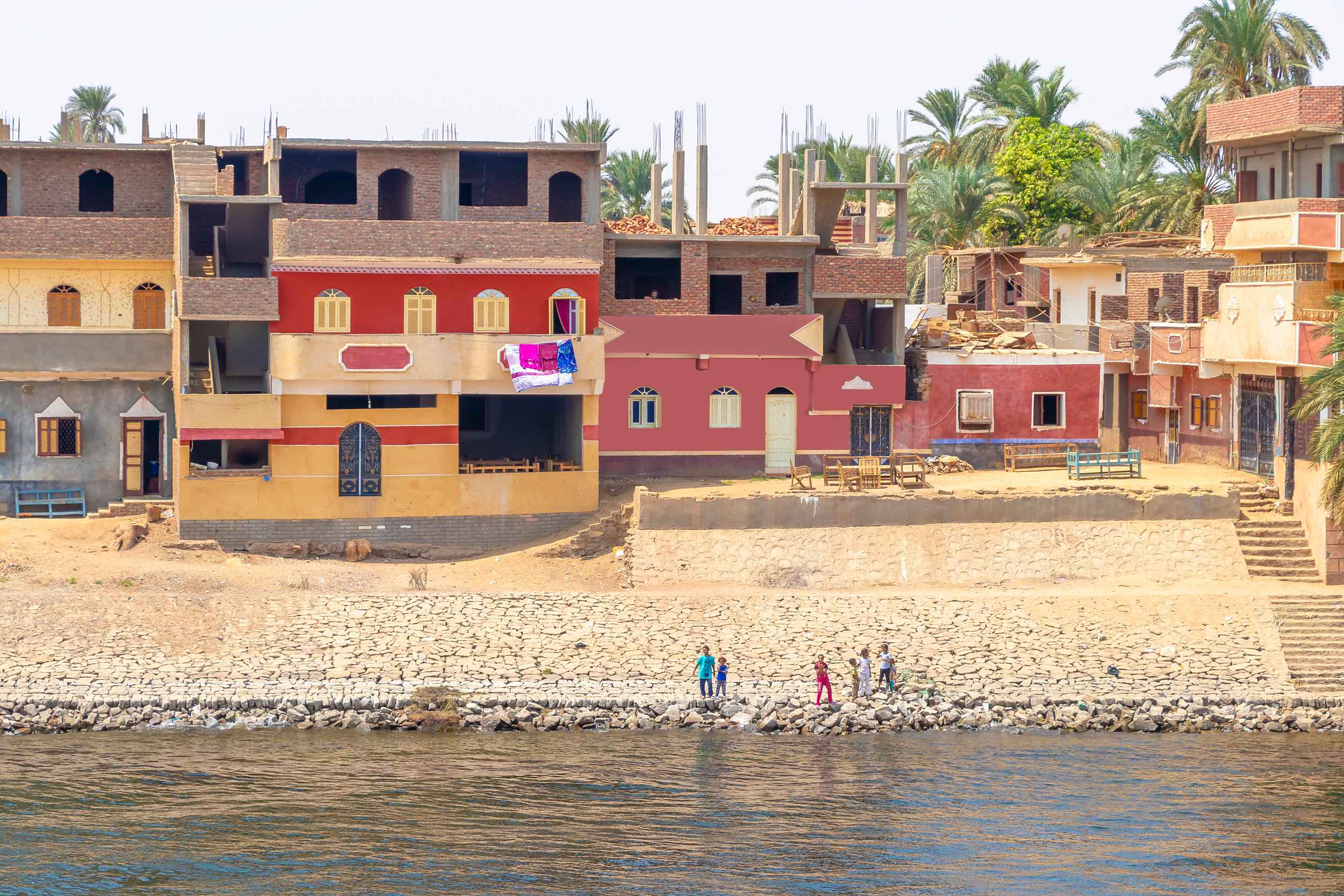 Houses along Nile River shore, Aswan, Egypt