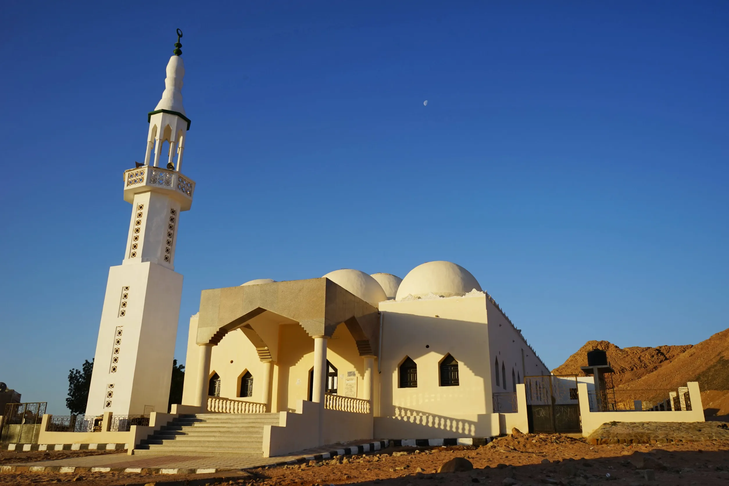 mosque in mountains sunrise and moon dahab