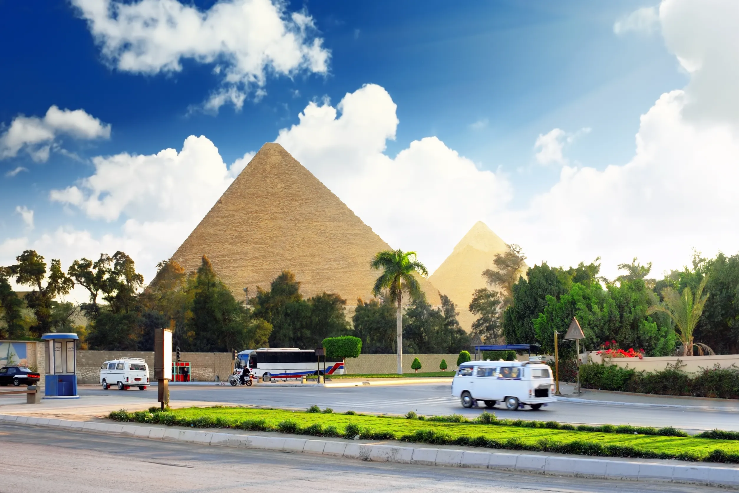 pyramids and present day of giza town suburb of cairo city egypt