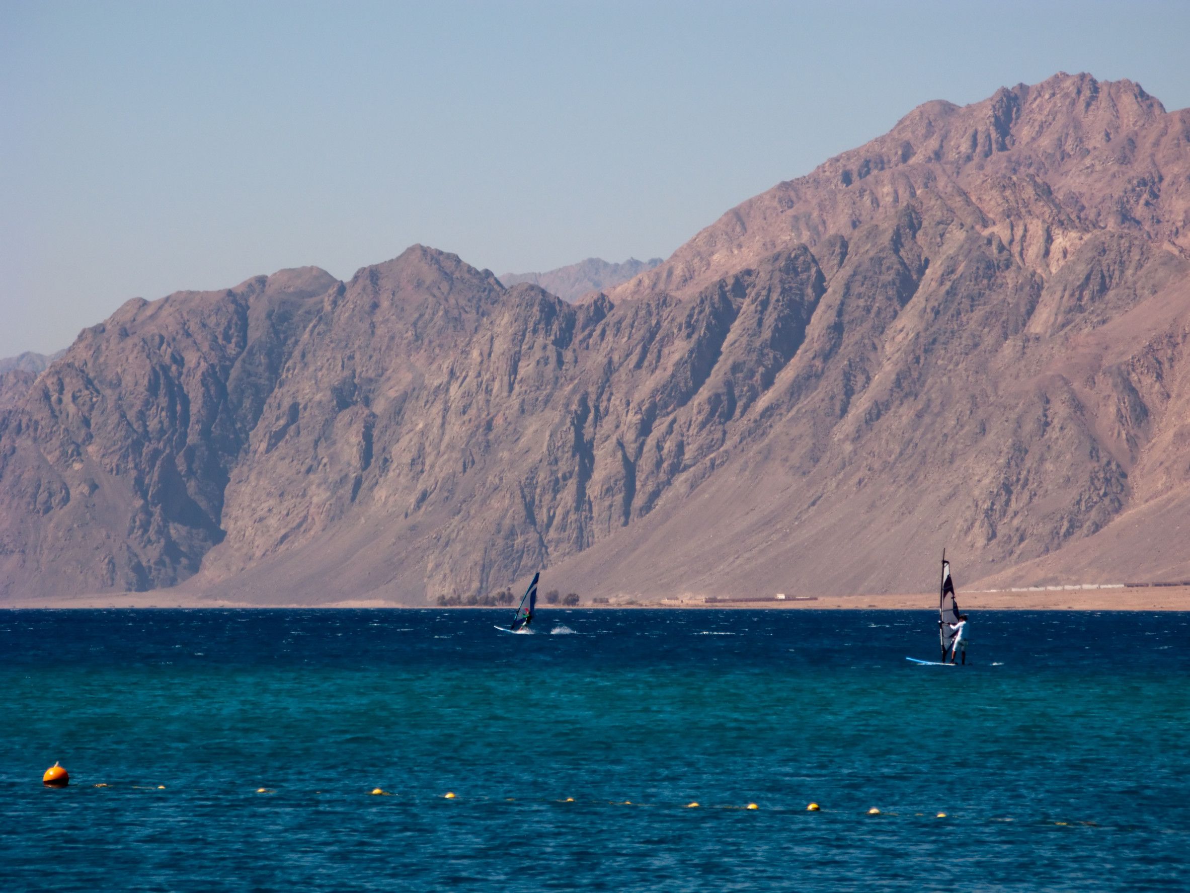 Windsurfers and mountain in the Dahab's gulf